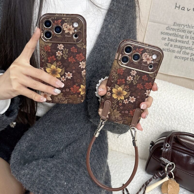 Brown Base Floral Sea Retro Floral Phone Case for iPhone16promax, gentle girl full coverage shockproof phone case with brown strap option