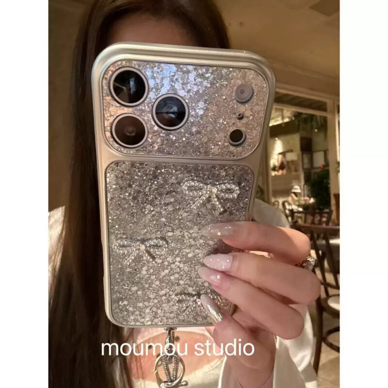 Lens Glitter Sparkling Diamond Bow Phone Case for iPhone17promax, luxury girl full coverage shockproof phone case with gray pom-pom bracelet option