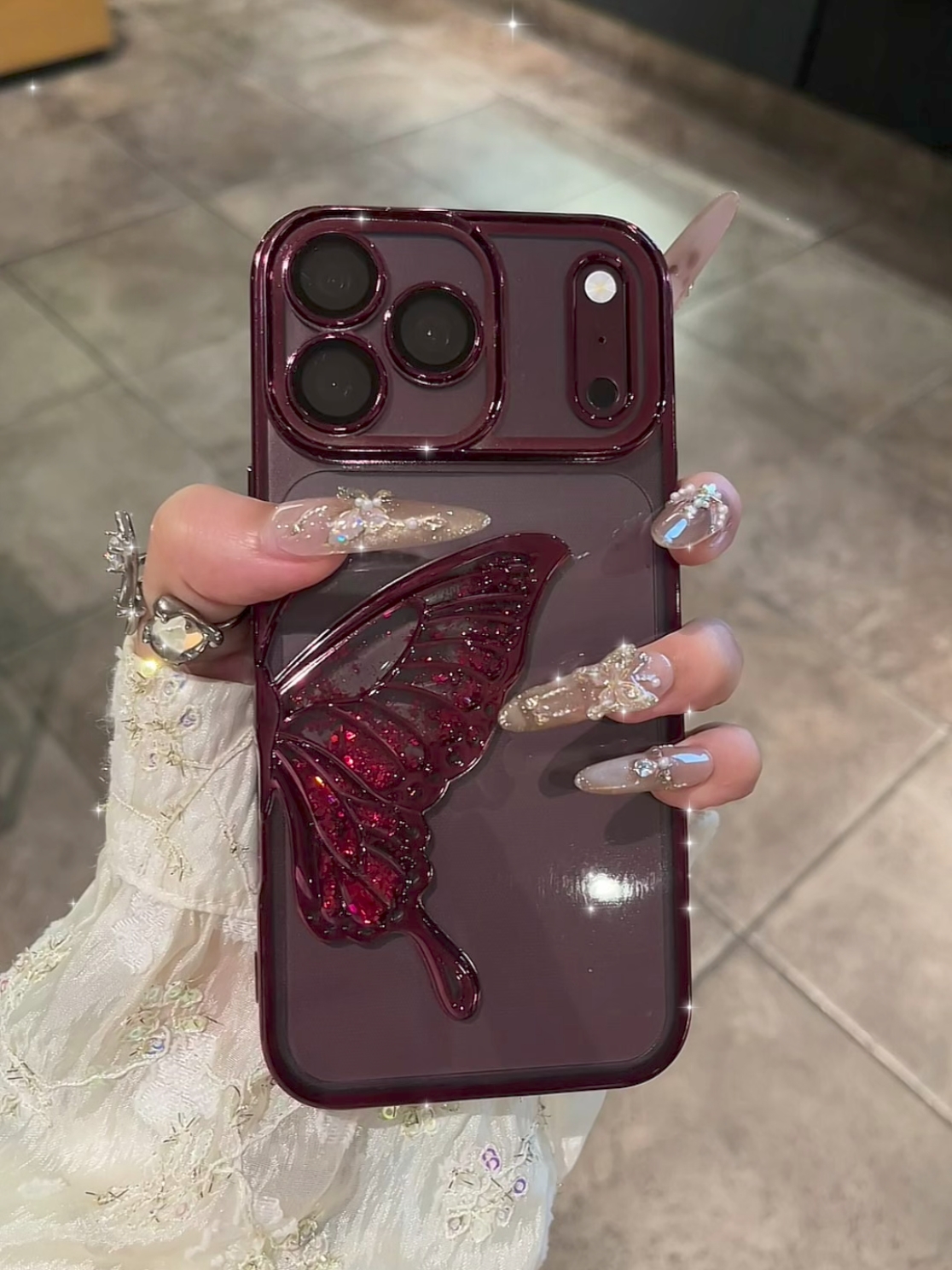 ChicCase Lab burgundy quicksand butterfly iPhone phone case, 3D liquid glitter butterfly decoration, electroplated frame with built-in lens protector, clear TPU shockproof cover with optional glitter paper, elegant women's protective phone case for iPhone